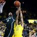 Michigan sophomore Jon Horford and Michigan State junior Adreian Payne compete for a rebound on Sunday, Mar. 3. Daniel Brenner I AnnArbor.com